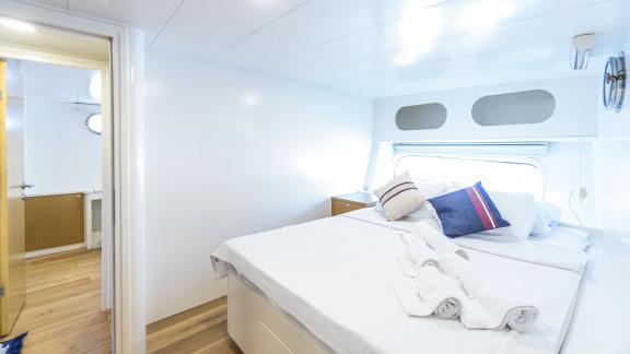 Spacious and bright double cabin with window and modern bathroom.