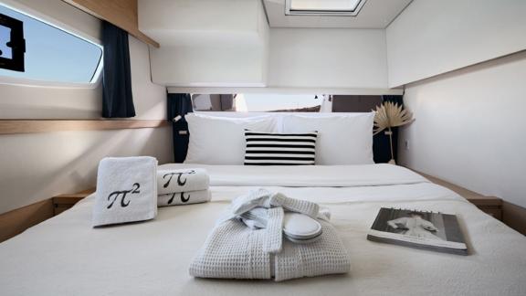 Elegant double cabin on the catamaran Pi 2 in Athens, equipped with fine amenities and modern decor.