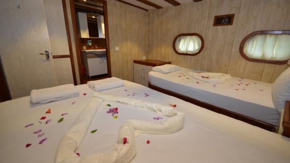 Cozy twin cabin with two single beds on Gulet Miss Vela in Marmaris. Ideal for friends or siblings.