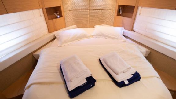 The bedroom of motor yacht Sabijac features a comfortable double bed.