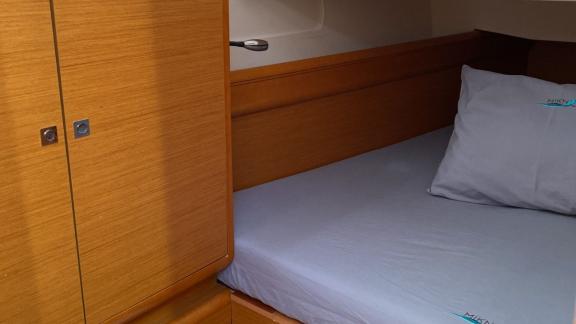 The double cabin of the Mercann sailing yacht offers a comfortable sleeping area with a simple and stylish design.