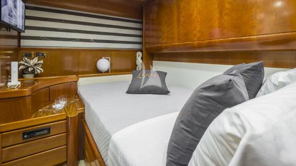 Simple and cozy double cabin on yacht Amoraki with comfortable decor.