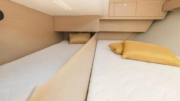 The cabin of the Gracia yacht is equipped with twin comfortable beds.