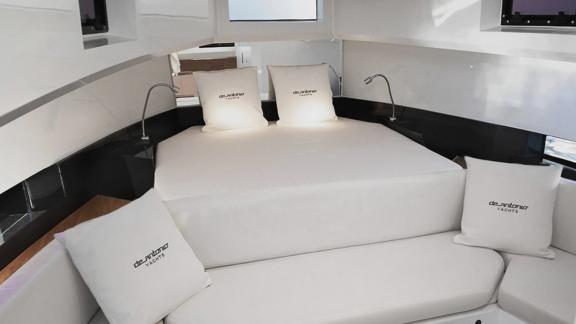 The spacious master bedroom of motor yacht Alegria offers a stylish and modern setting for a restful sleep.