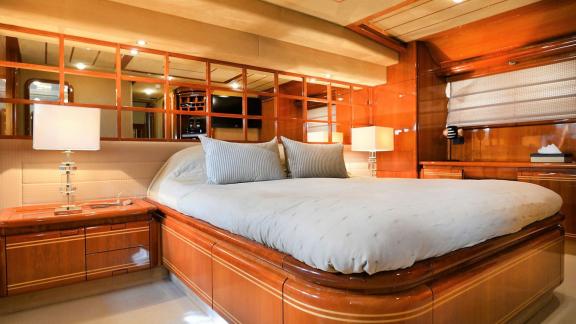 Spacious master bedroom on the yacht Kentavros 2 with comfortable and luxurious details.