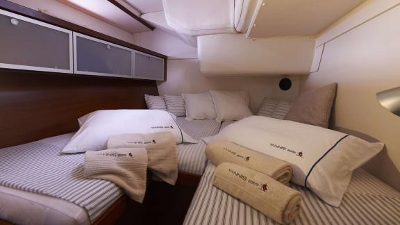 The comfortable double bed on the Yannis 65S yacht offers a luxurious and cozy sleep experience.