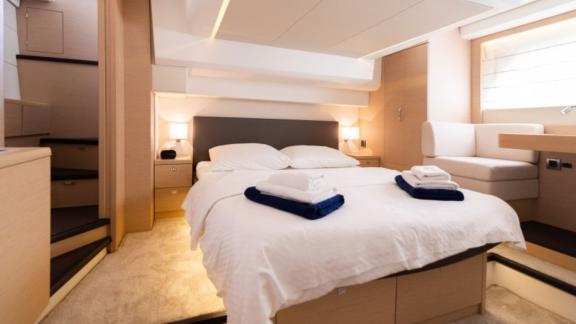 Spacious and comfortable bedroom of motor yacht Serendipity I.