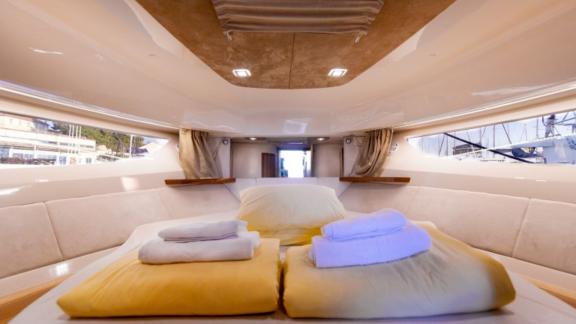 Comfortable cabin with a large bed on the motor yacht North Star.