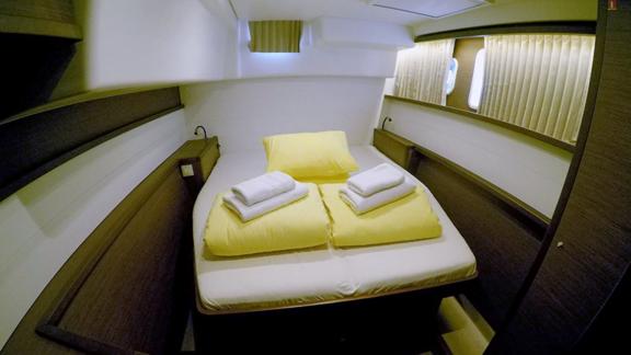 Luxurious master cabin with a large bed and stylish decor for maximum comfort.