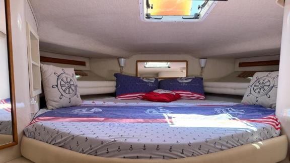 The comfortable and spacious guest bedroom of motor yacht Liberta offers a relaxing stay.