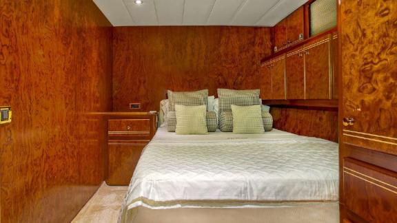 The luxurious bedroom of motor yacht Julem 1 features a comfortable design.