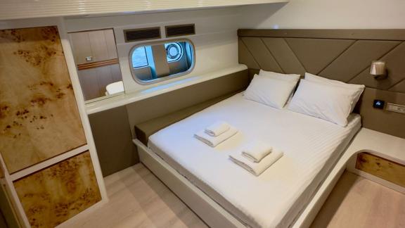 Modern double cabin with a large window on Angelo 3 yacht.