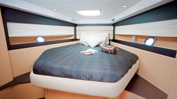 Spacious and comfortable double cabin on motor yacht Xenia, featuring modern decor and lighting.