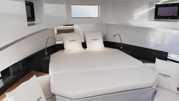 Spacious bedroom on motor yacht Ikigai offers a comfortable stay.