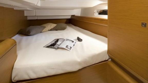 The spacious double cabin of the Mercann sailing yacht provides an ideal space for a restful night's sleep.