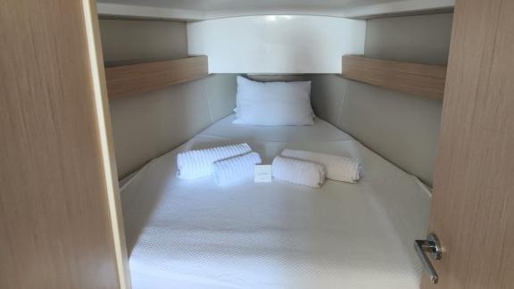 The spacious double cabin of Lima yacht offers a comfortable bed and clean towels.