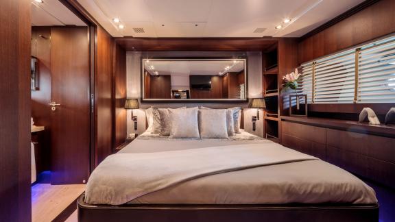 The master cabin on yacht Miraval stands out with luxurious details and elegant decor.