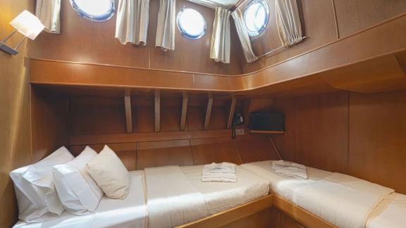 Comfortable twin bed cabin on gulet Arktos for two guests.