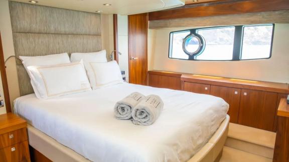 Comfortable bedroom with sea view on the Midnight Summer Dream yacht.