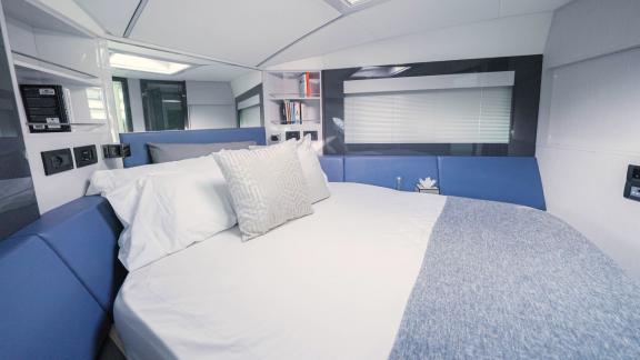 Ideal for Dubai motor yacht rental, Pershing 5X White offers an elegant and cozy bedroom for a luxurious experience.