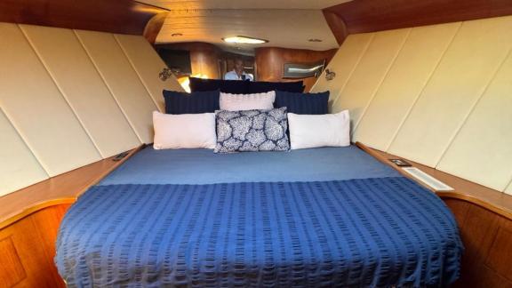 Rent a luxury yacht in Naples and relax in the spacious and comfortable master cabin of Skins for an unforgettable vacat