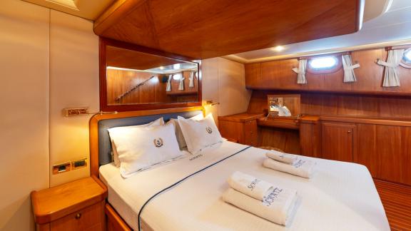 The cabin of Mein Schatz features ample storage and a cozy bed, perfect for a gulet charter in Bodrum.