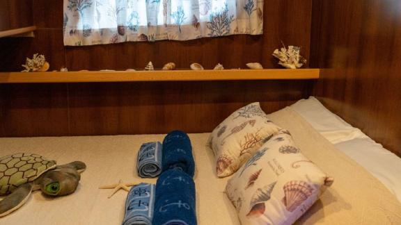 Sea-themed pillows and decorative items in cabin of Barbaros 3 yacht.