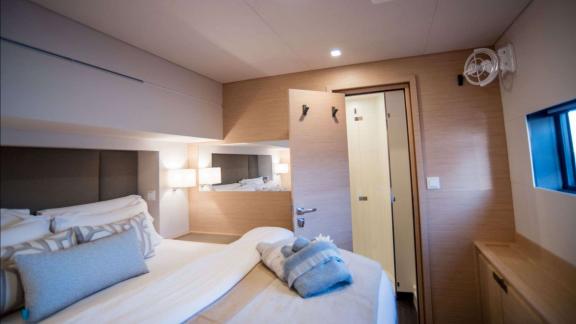 Spacious master suite with modern design on the 7th Heaven catamaran in Athens.