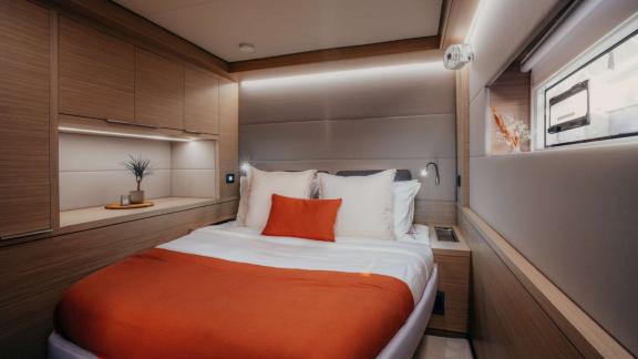 The cabin on Almosta Road features a bright bed, storage and a view through the window.