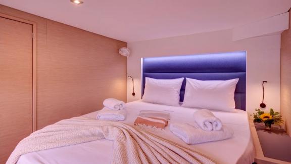 Helidoni charter catamaran offers a stylish cabin with soft light and double bed.