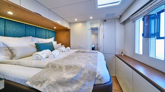 This Sunreef 60 Sinata cabin offers sea views, elegant textures and cozy modern comfort.