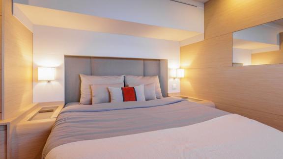 The Ariva features a clean cabin design with large bed, mirror wall and soft color palette.