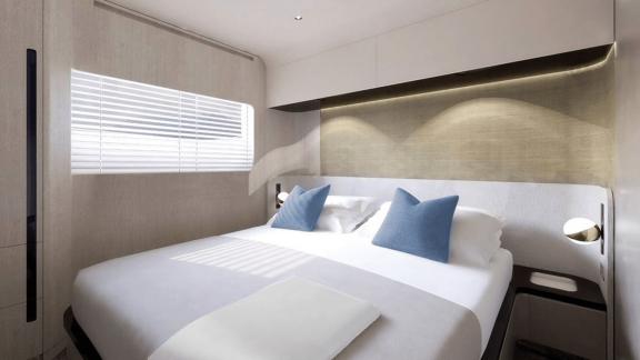 Modern and cozy cabin with double bed and stylish blue pillows, perfect for relaxing on board.