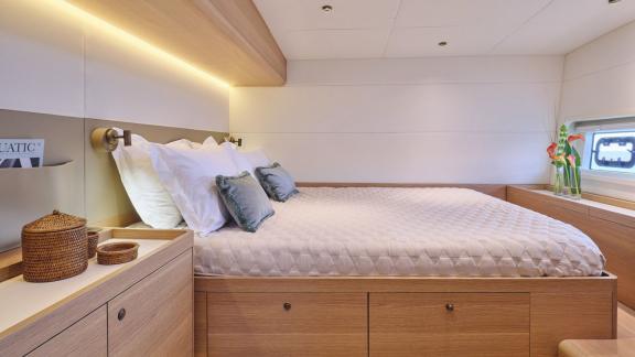 Off Lavrion the 3 cabin 6 guest Omikron Yachts OT 60 N ice featuring a cozy double cabin with wood interior.