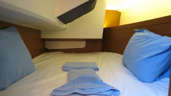 The cabin on Sarita is equipped with a comfortable bed and soft pillows.