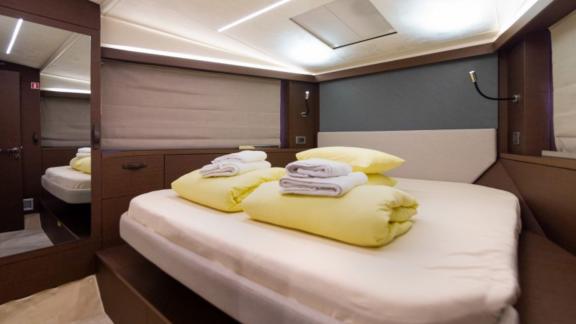 The bedroom on the motor yacht Brigadoon features a bright and comfortable design.