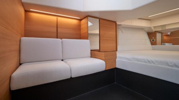 The seating area in the main cabin of Jemima motor yacht features a modern design and comfortable seating.