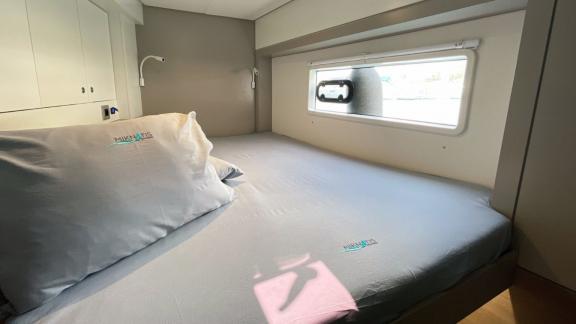 Spacious and comfortable sleeping cabin in Bali 4.2 Catamaran Bella II, perfect for relaxation and rest.