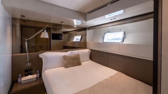 The guest cabin of San Lorenzo Sx88 combines comfort and modern design for luxurious yacht rental in Dubai.