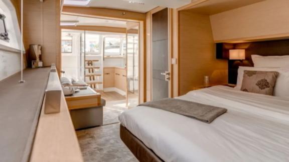 Grace Lagoon 620 catamaran master cabin features elegant design and bright space.