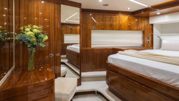 The Sunseeker 75 master cabin features mirrored closets, soft carpeting and modern lighting near Split.