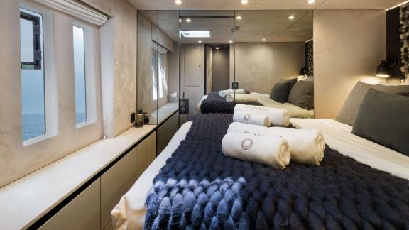 Panoramic windows, cozy bed and modern interior aboard Sunreef 60 Ahalya.