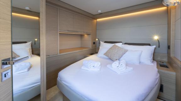 On the Lagoon 55 model catamaran Artisan, this guest cabin offers elegant features and serene comfort for your stay.
