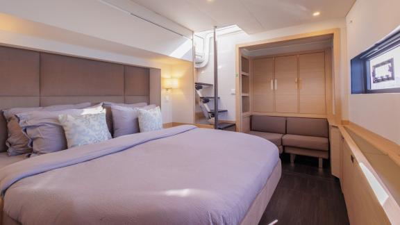 The Ariva features a bright cabin with a large bed, sofa, wardrobe and window for natural light.