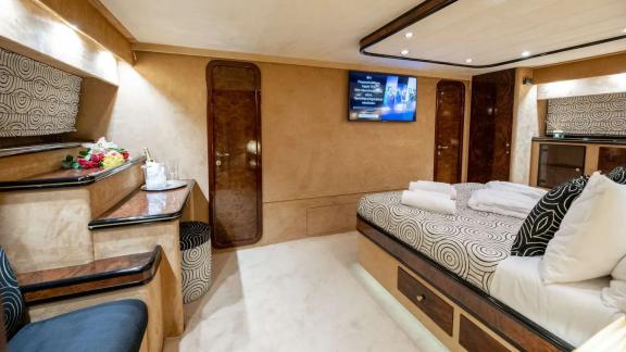 The double cabin of Wish Alfamarine 91 includes a large bed, TV screen and vanity desk.