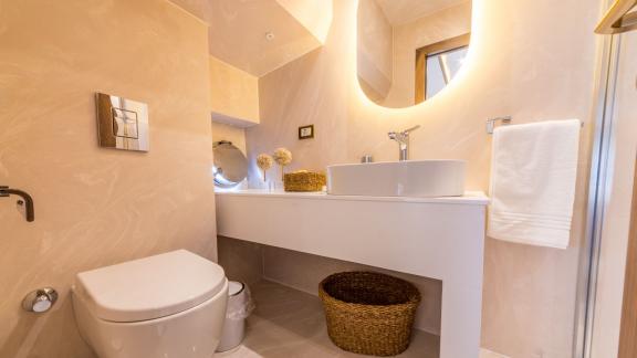 The bathroom on the Floki trawler yacht features a modern and minimalist design.