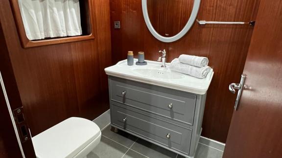 The bathroom of gulet Rose Sah features a stylish sink and a modern toilet.