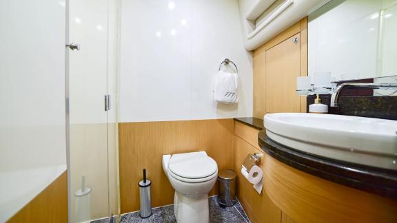 Modern bathroom on yacht Stela 117 provides comfort and style.