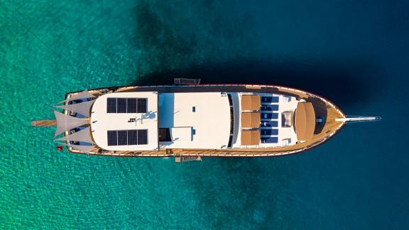 In Göcek gulet charter option Always Smile top view with sunbeds full deck layout and aft seating area visible.