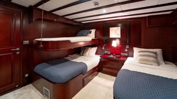 In Göcek gulet charter option Always Smile cabin with bunk bed and single bed layout visible.